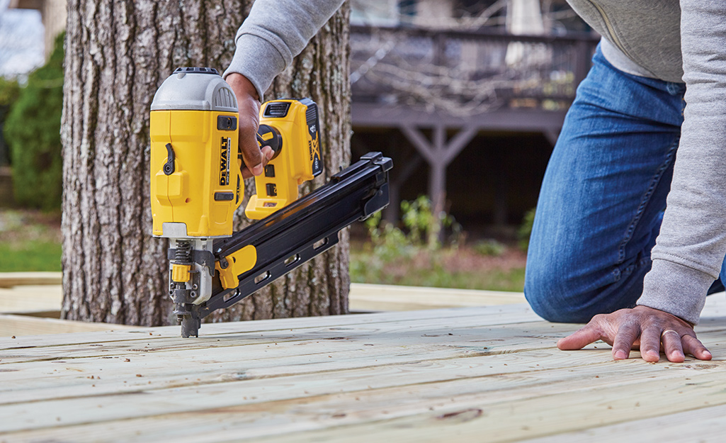 A nailer is used to attach deck boards to a platform.
