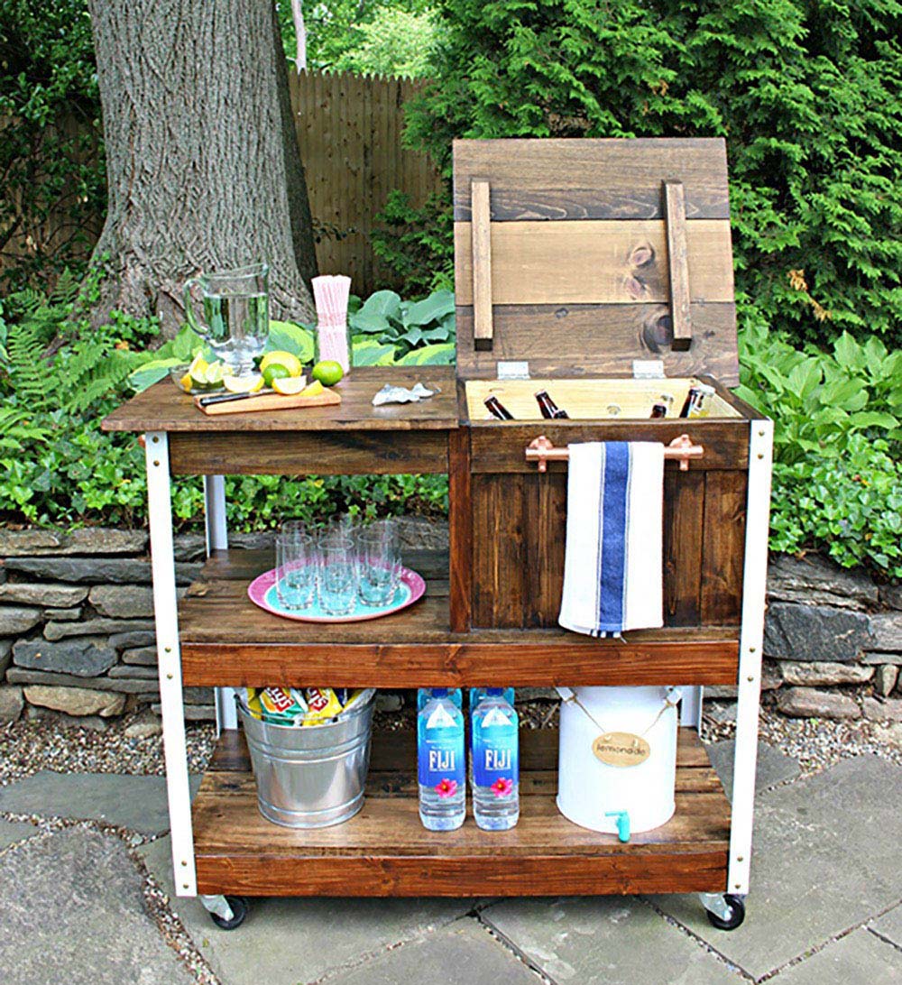 A decorated wooden grill cart with copper accents