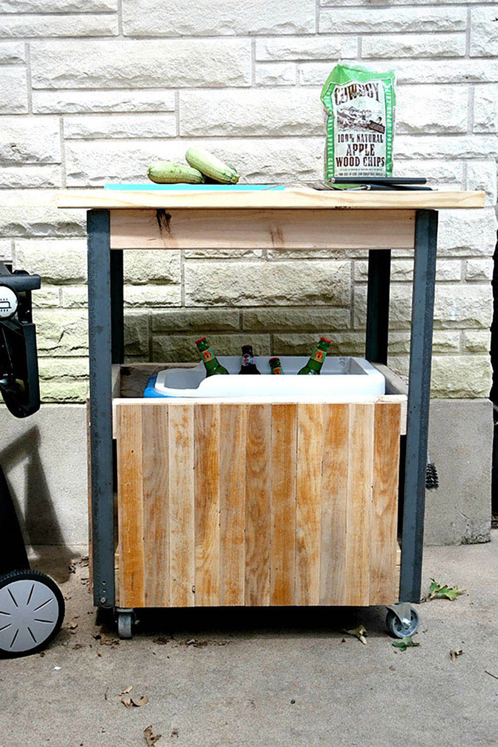 A DIY grill cart with a cooler enclosure on the bottom.