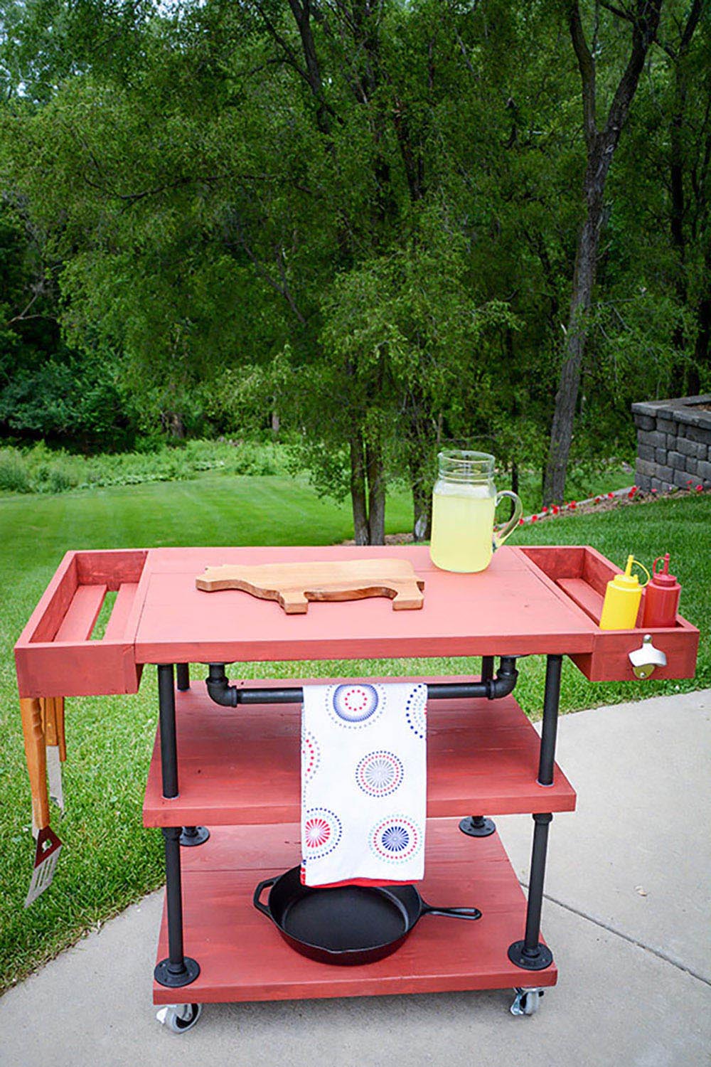 A DIY grill cart with side trays and a bottle opener on the side.