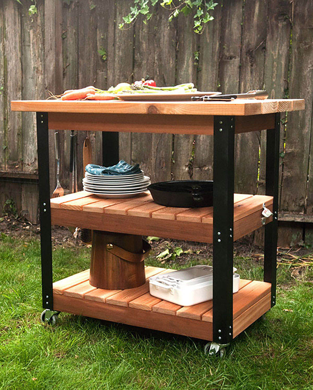 A DIY grill cart with black accents and three tiers.