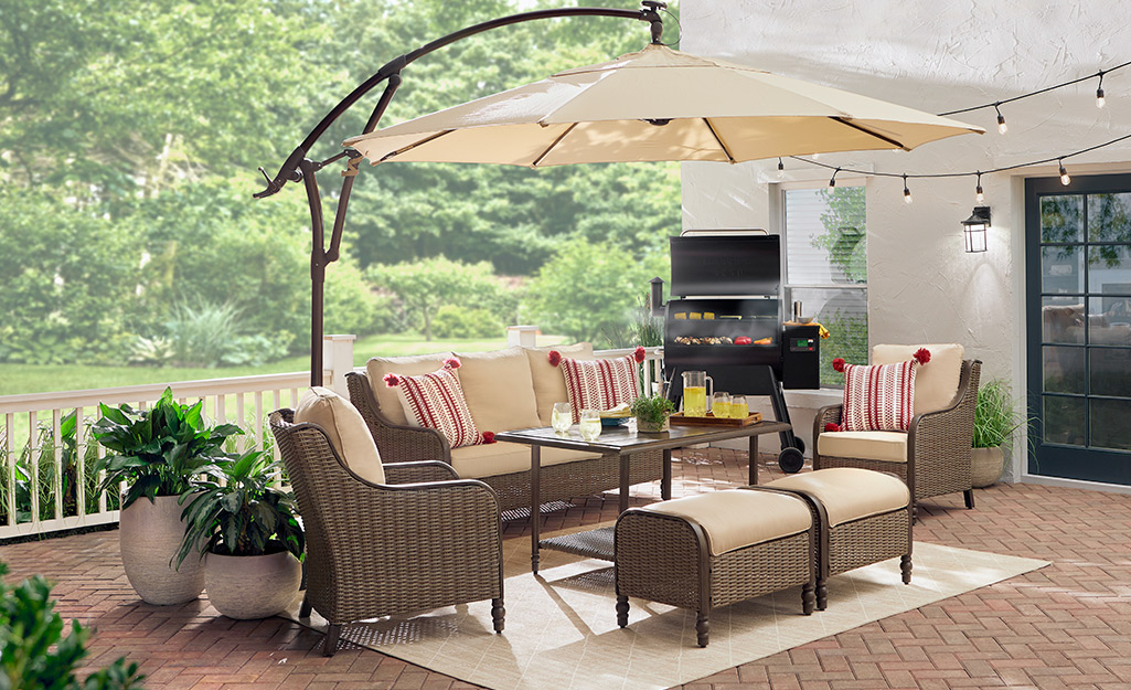 A cantilever umbrella above patio seating.