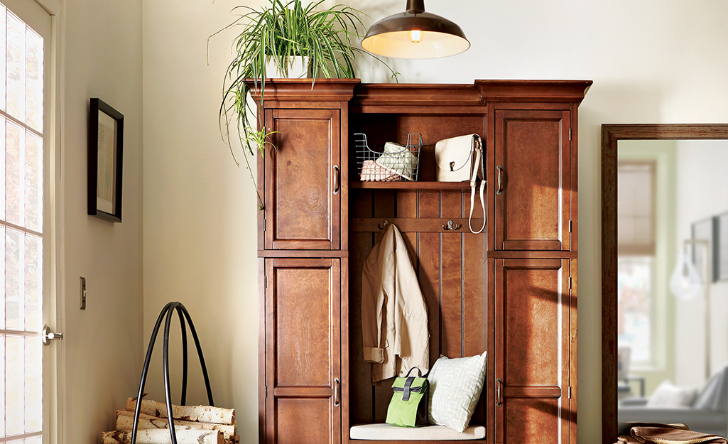 A wood cabinet with houseplants