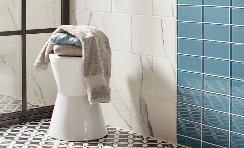 A stool made to withstand the elements in a bathroom doubling as storage.