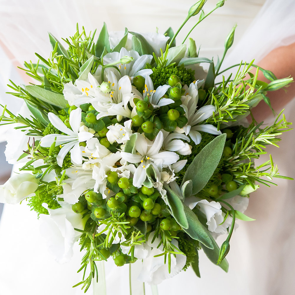 A person holds a wedding bouquet.