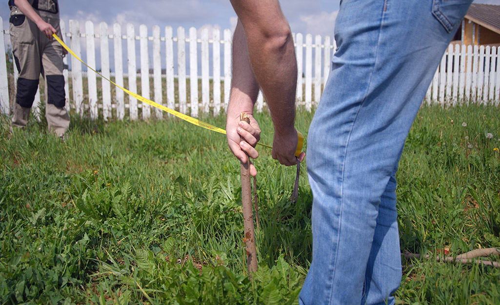 measuring to have a fence installed