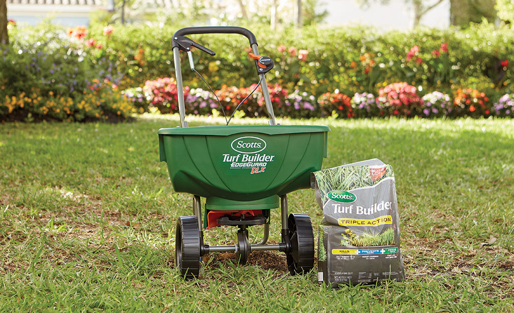 Spreader with weed and feed product