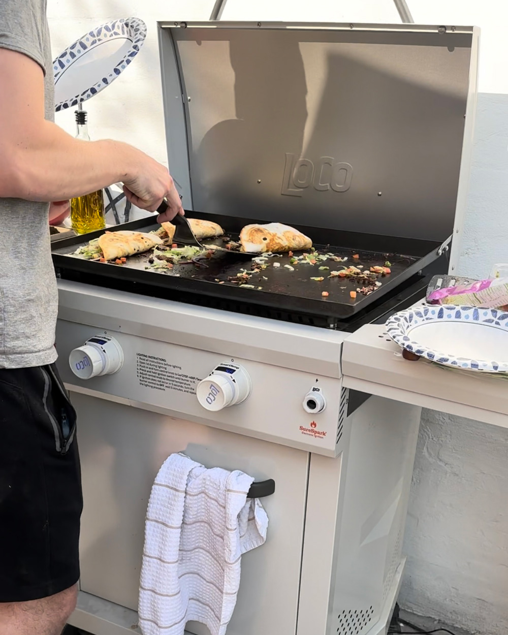 A person grilling tacos. A person grilling tacos.