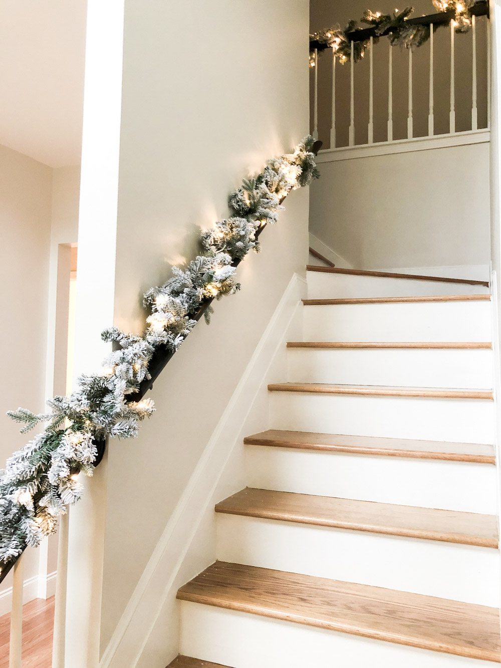 Starry Frosted LED Pre-Lit Garland on banister.
