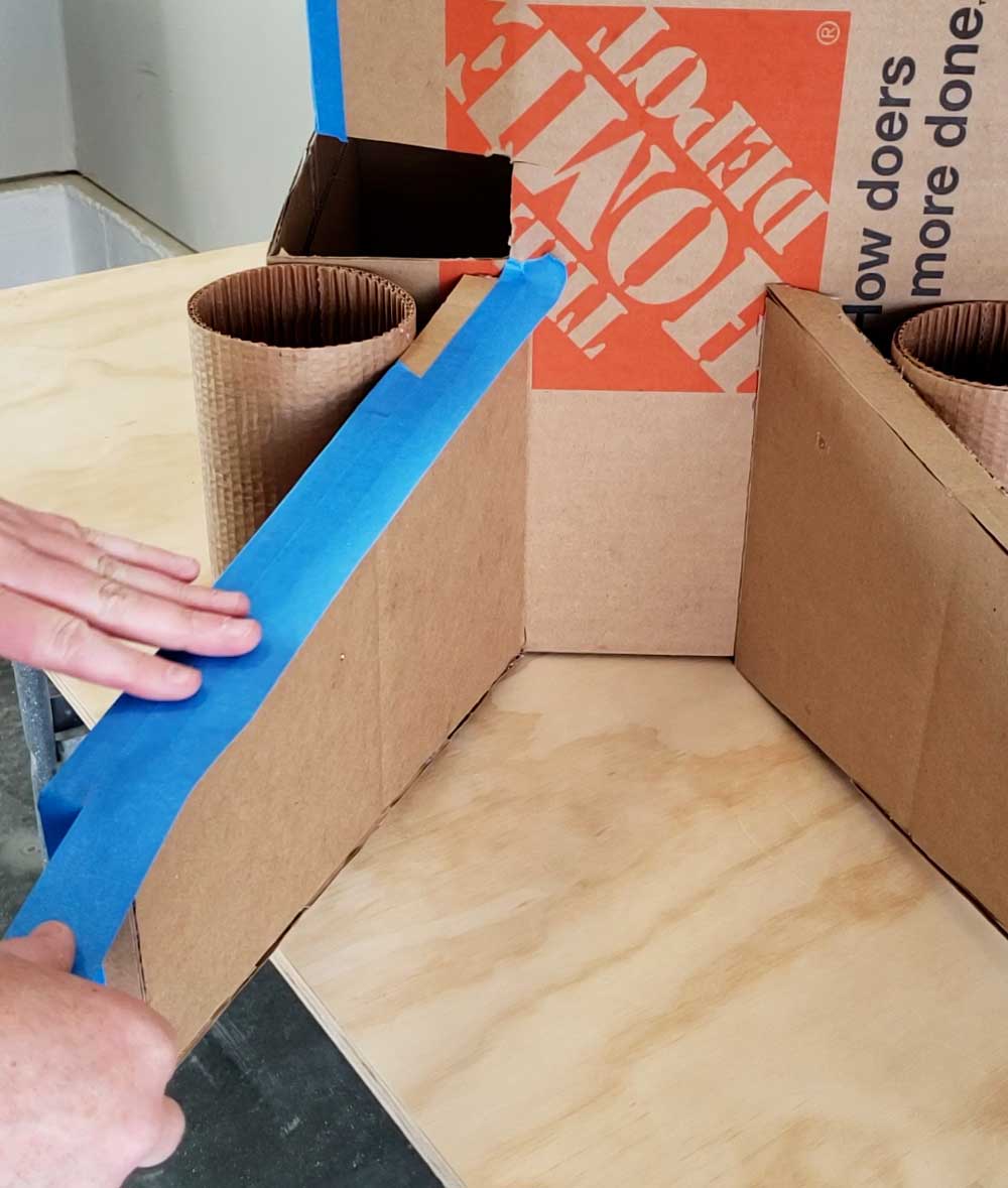 Taping the open gaps of the boxes together