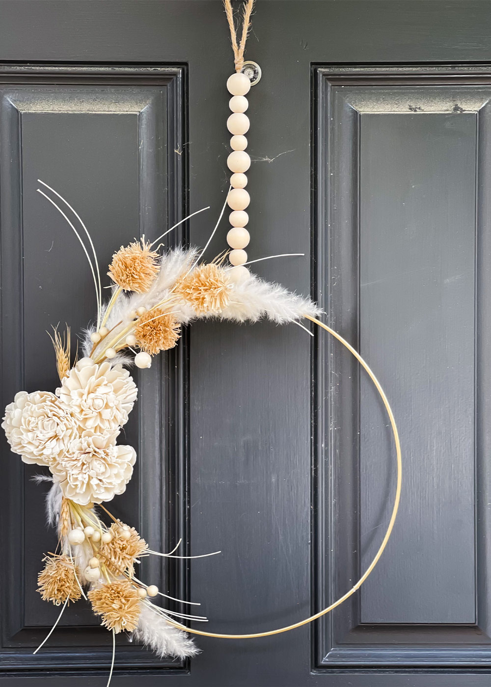 Finished boho wreath hanging on front door. 