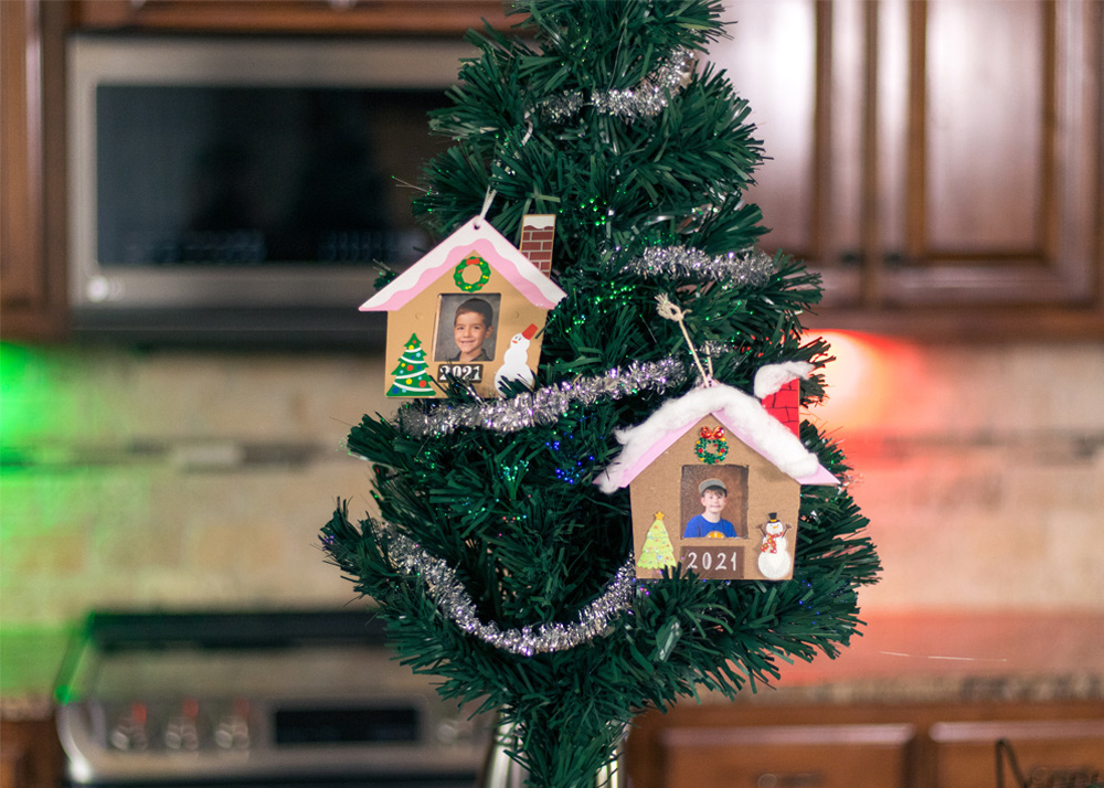 Mini Christmas tree with house ornaments.