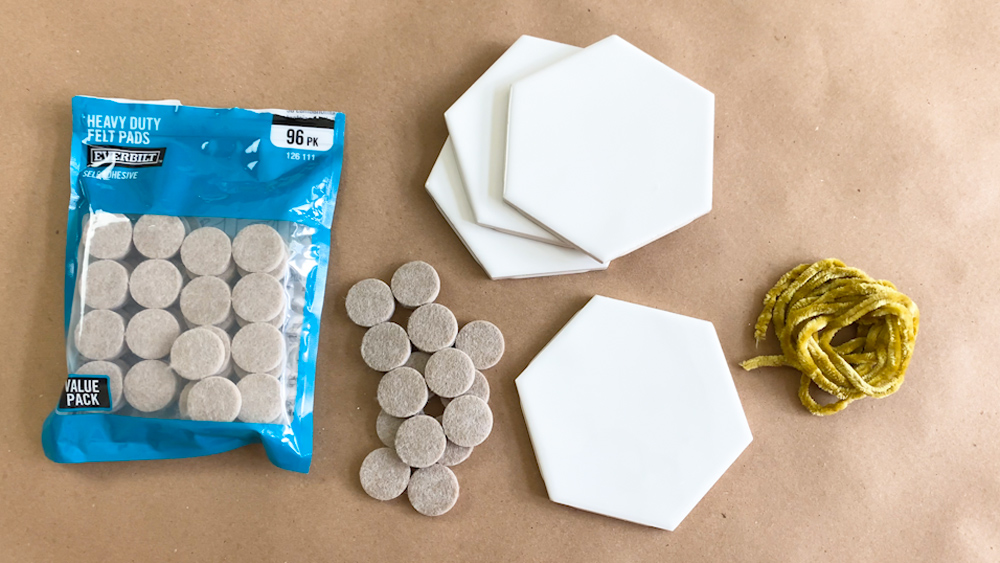 Materials needed for a DIY Tile Coaster set.
