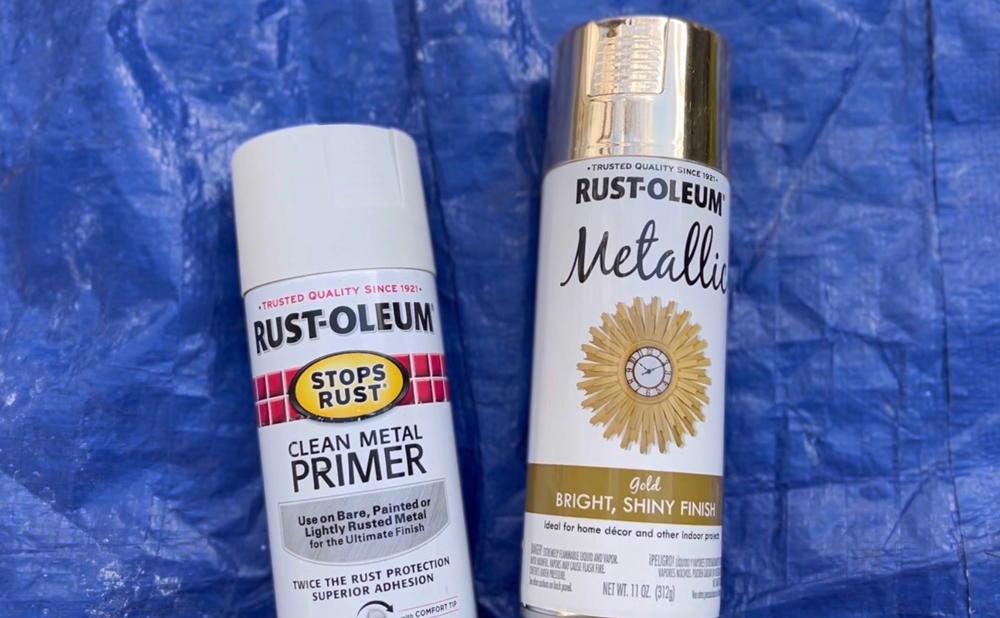 Cans of white and gold Rust-Oleum spray paint.
