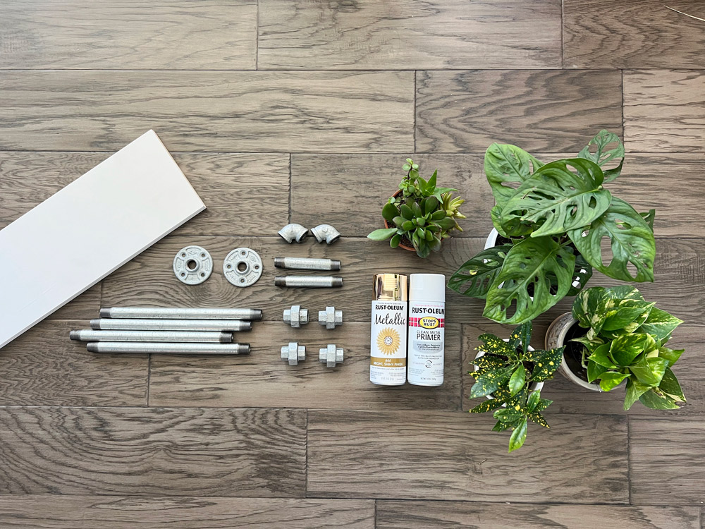 Materials needed to build a DIY Plant Shelf on a floor.