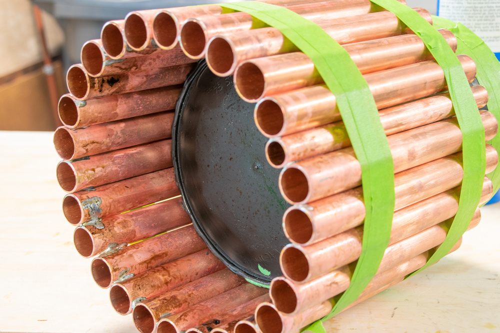 A soldered DIY Copper and Wooden Planter base