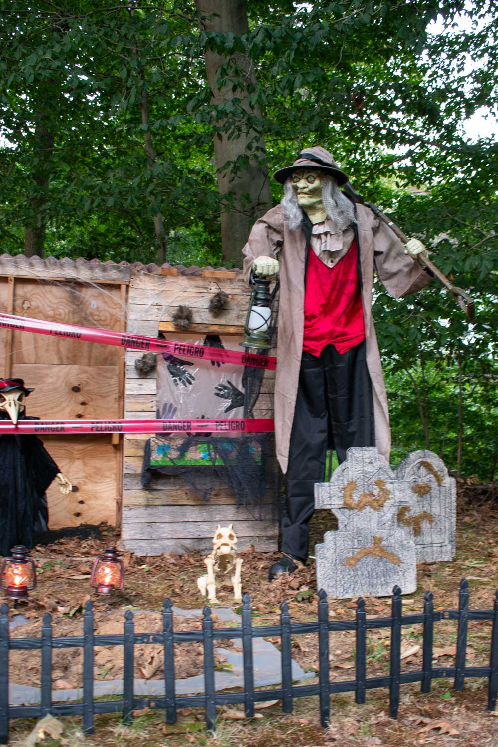 A scary graveyard filled with Halloween decorations.