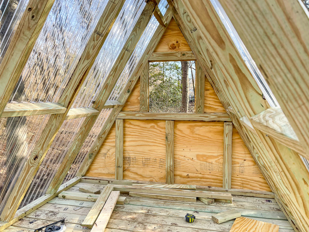 Inside framework of a wooden playhouse.
