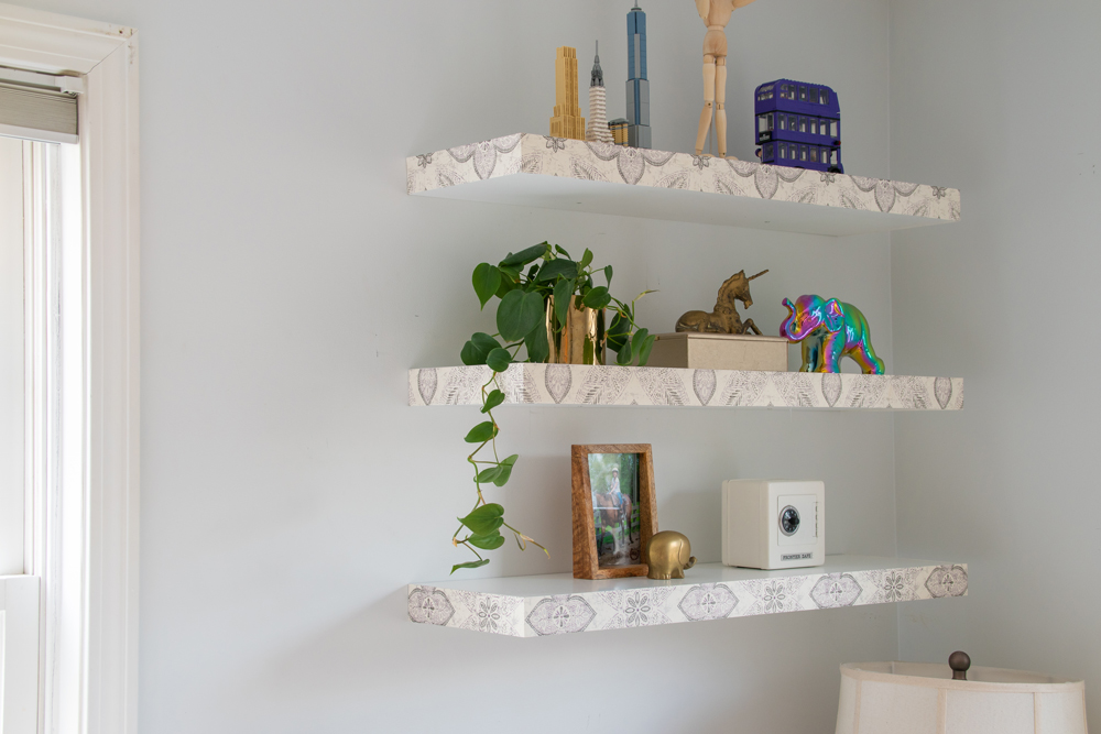 Three decorated floating shelves.