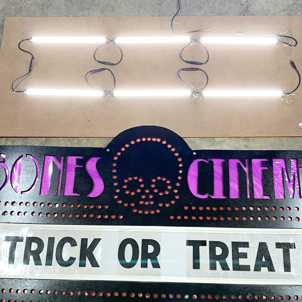 Bones Cinema marquee with “Trick or Treat” text.