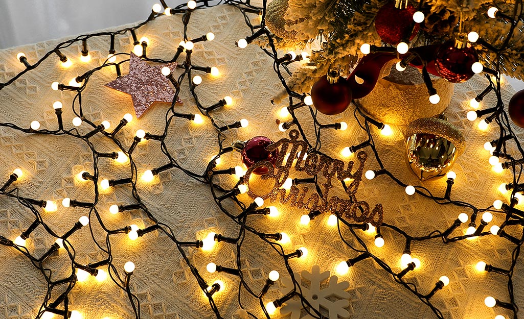 Mini Christmas lights on a rug.