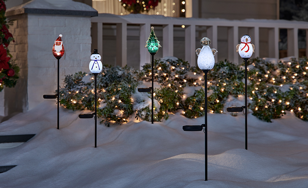 Solar Christmas lights placed in the snow.