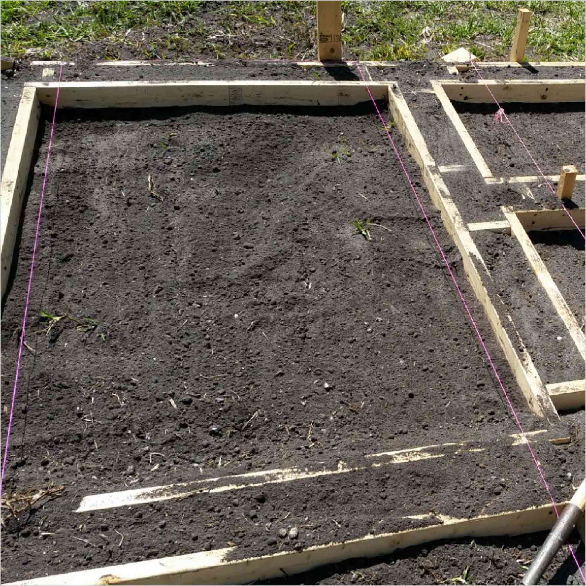 Wooden forms for poured concrete pavers.