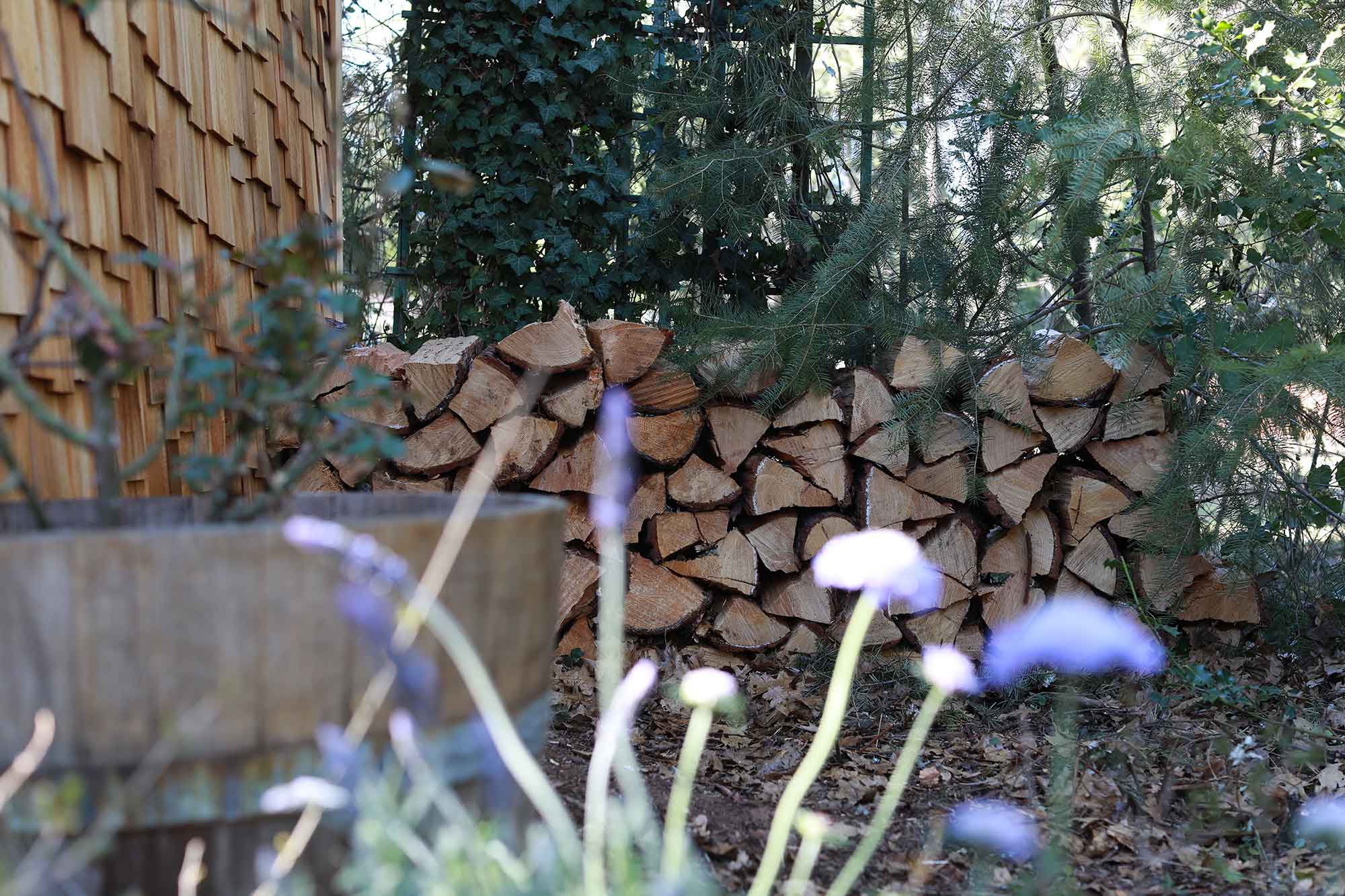logs stacked up in a corner logs stacked up in a corner