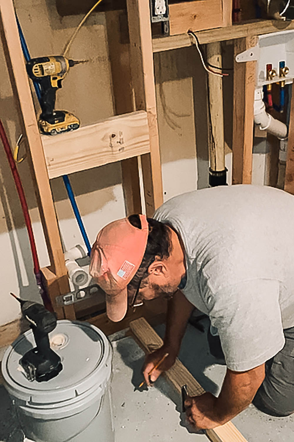 Man measuring his wood before cutting it. Man measuring his wood before cutting it.