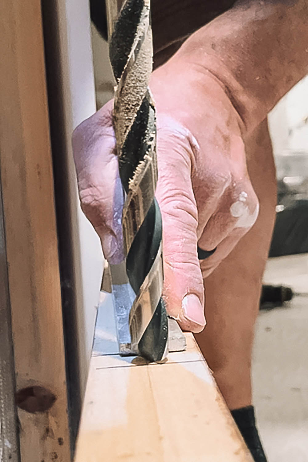 Drilling holes into wooden plank. Drilling holes into wooden plank.