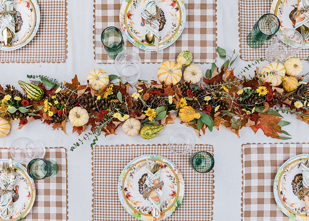 Finished Friendsgiving table with garland. Finished Friendsgiving table with garland.