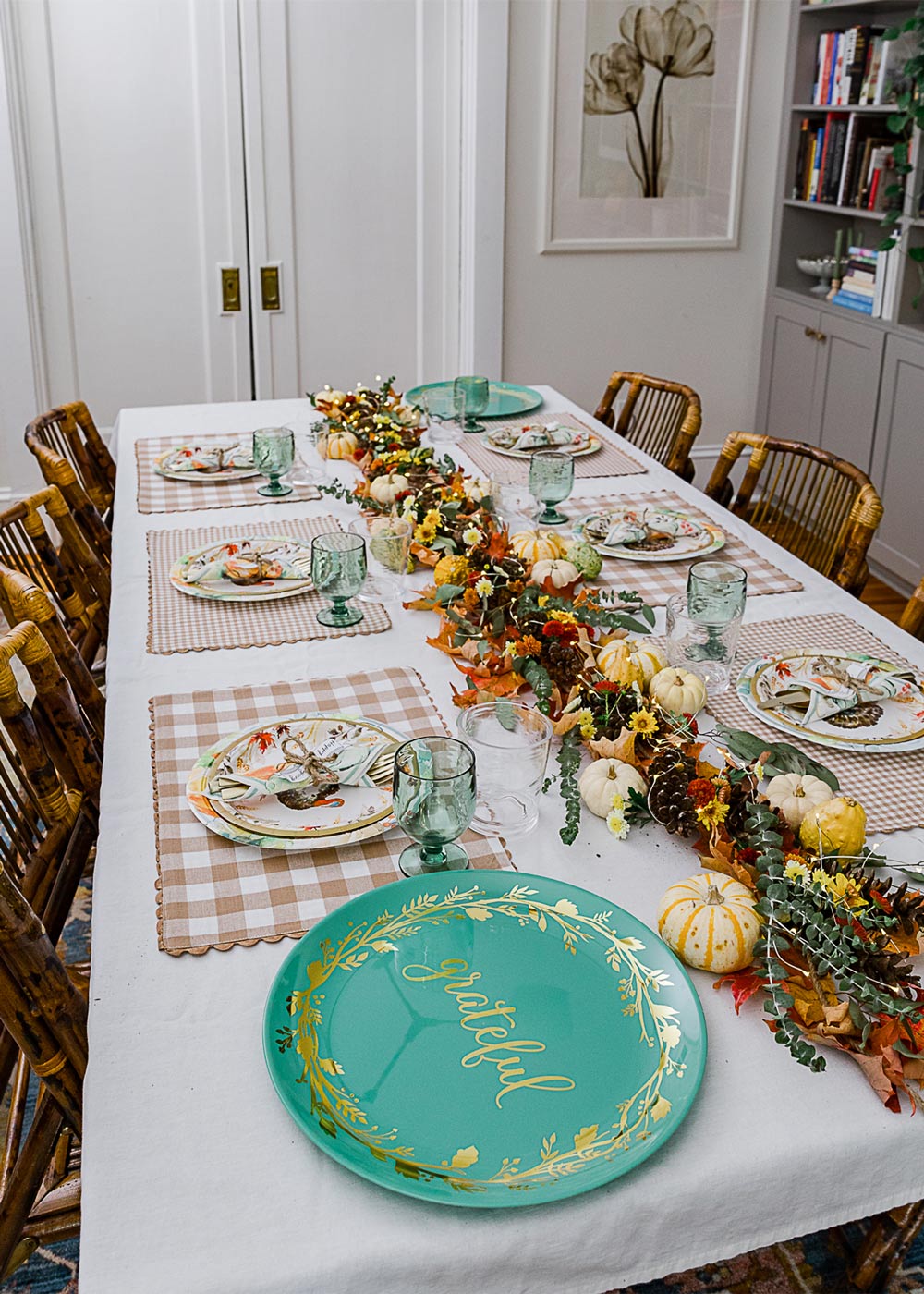 Finished Friendsgiving table with garland. Finished Friendsgiving table with garland.