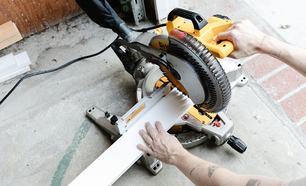 A person cutting boards with a circular saw.