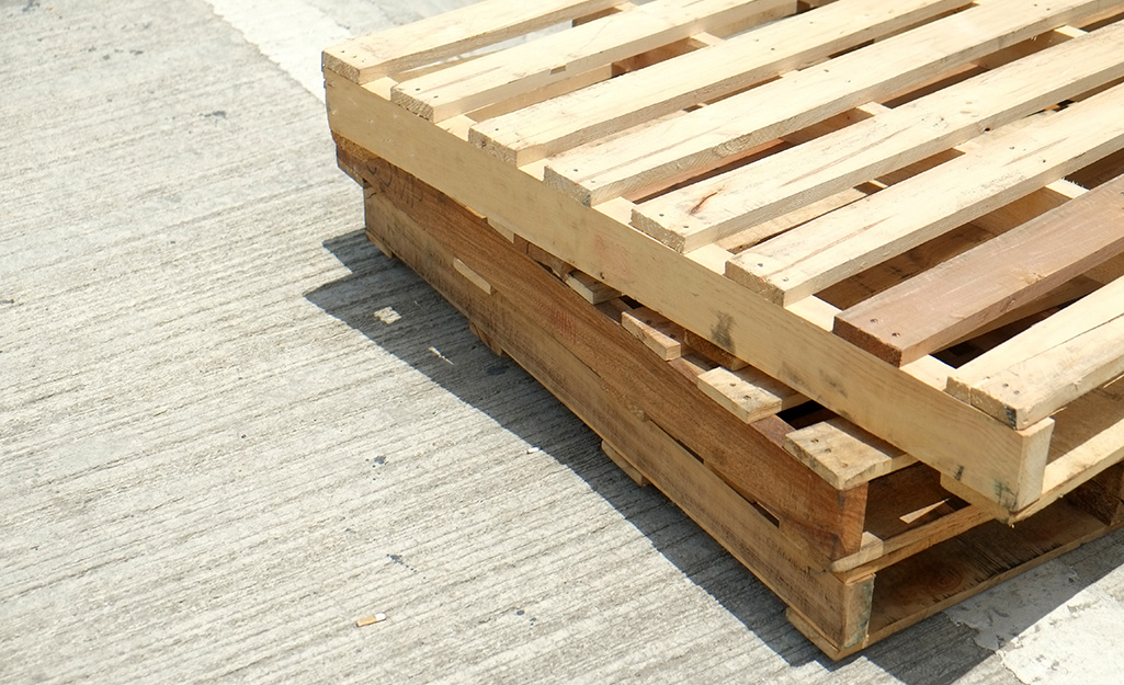 One pallet stacked on top of two others.