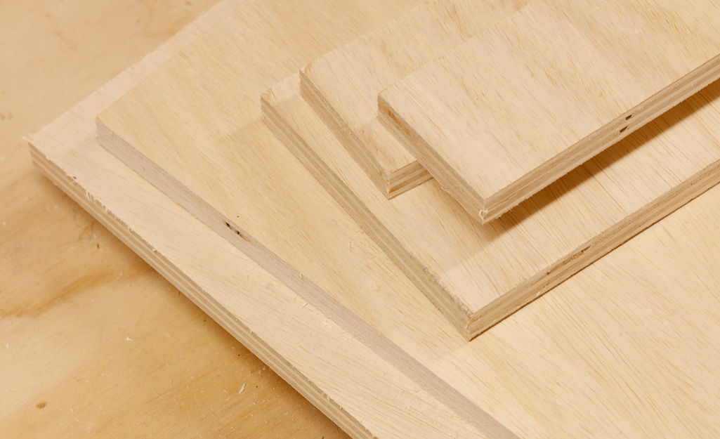 Cut pieces of plywood are ready to be used for a DIY desk project. Cut pieces of plywood are ready to be used for a DIY desk project.