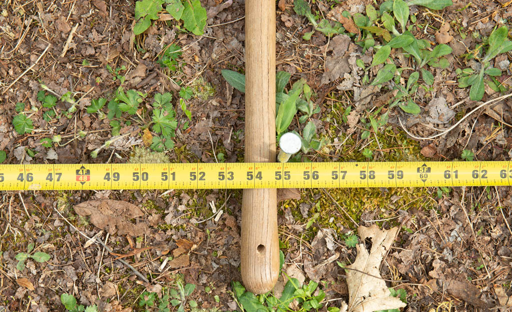 picture of tape measure marking ground