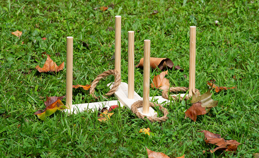 A ring toss game on a lawn. 