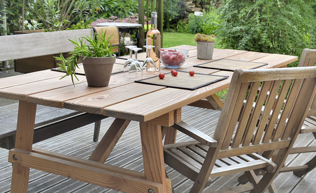 An outdoor picnic table and chair.