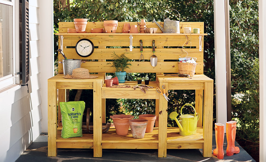 A completed potting bench with garden accessories.