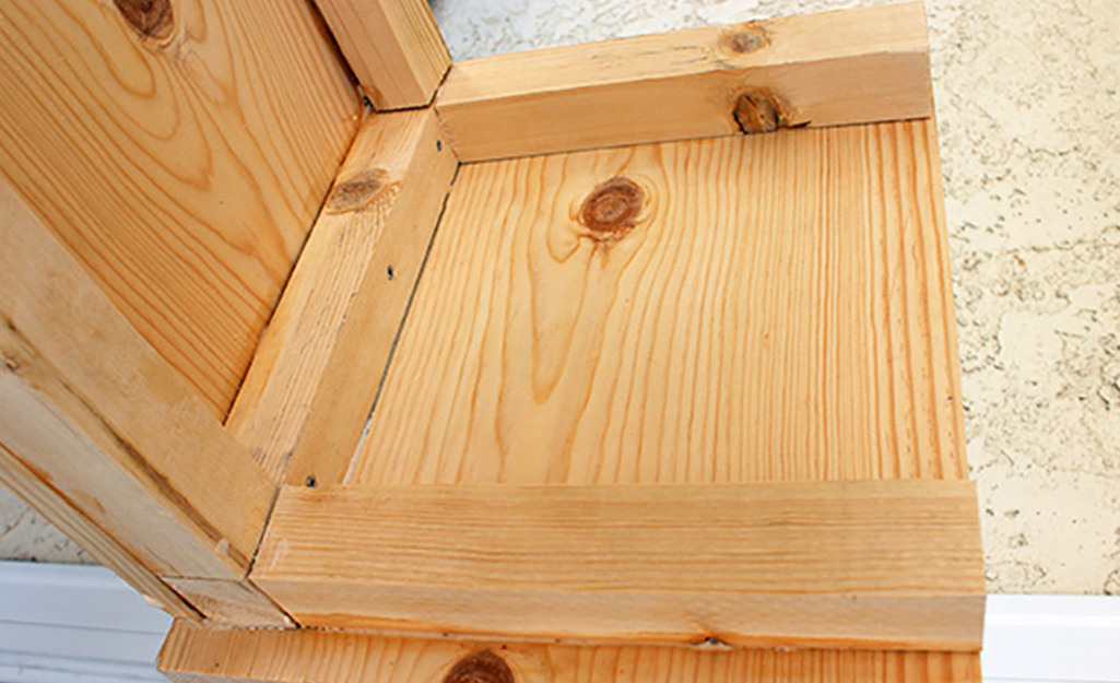 A section of the window box with supporting wood boards.