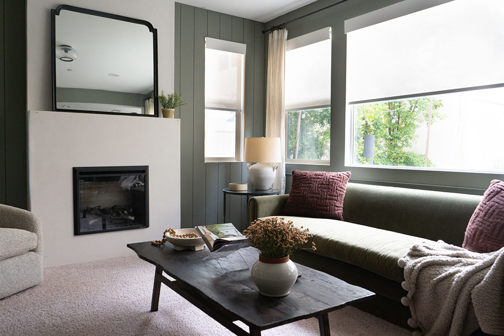 A room with large windows with white window treatments pulled down on a sunny day. A room with large windows with white window treatments pulled down on a sunny day.