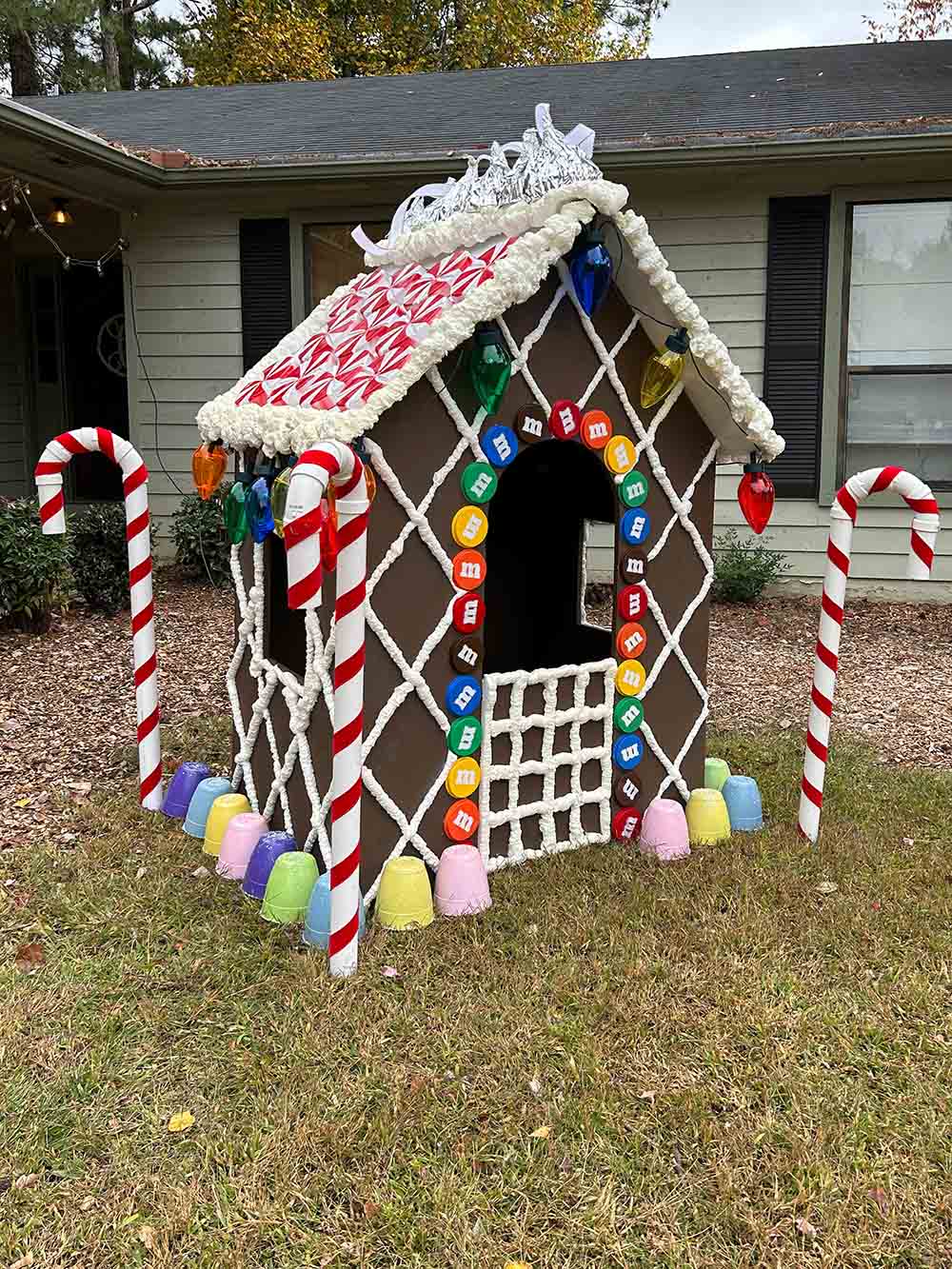 A life size wooden gingerbread house.