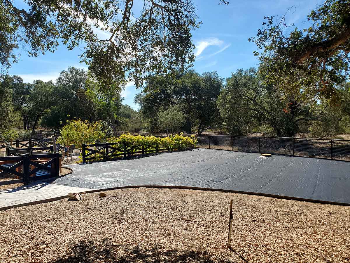 backyard with dirt tarped over backyard with dirt tarped over