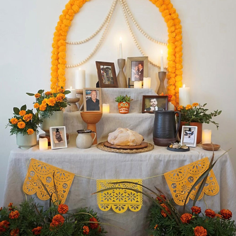 A completed Ofrenda garnished with decorations.
