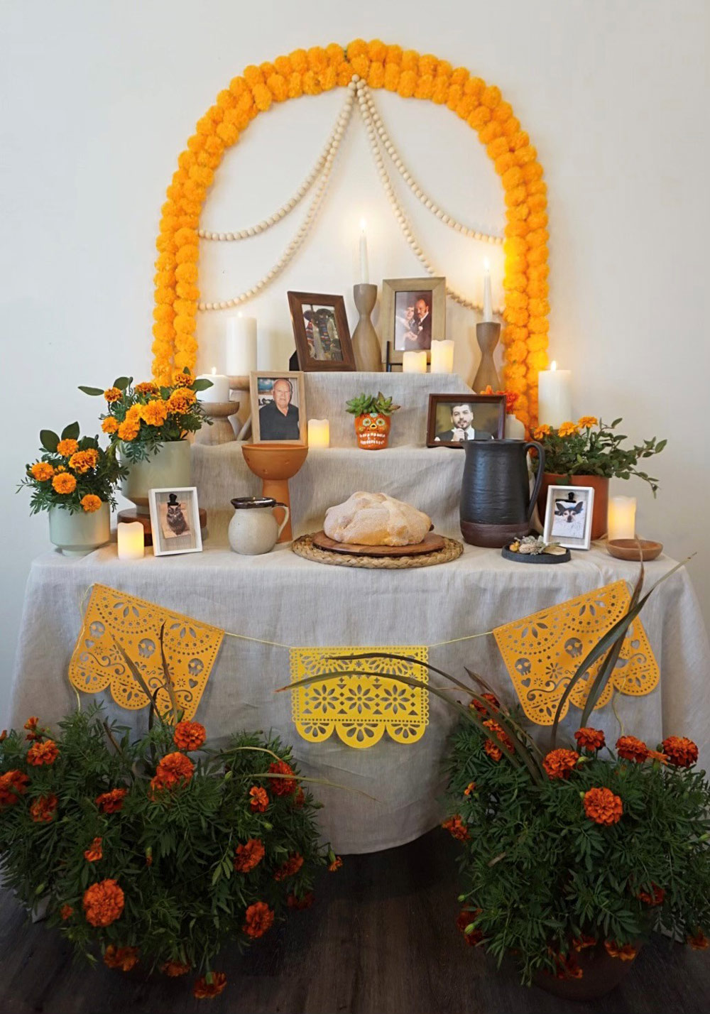 A completed Ofrenda garnished with decorations.