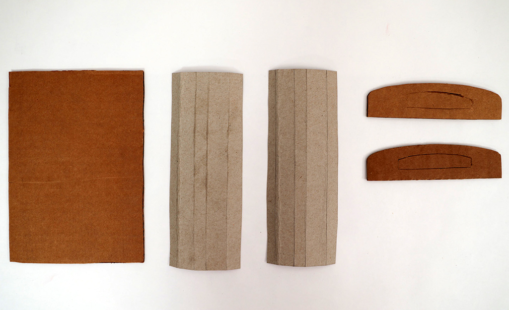 Cardboard in various sizes sit on a table.