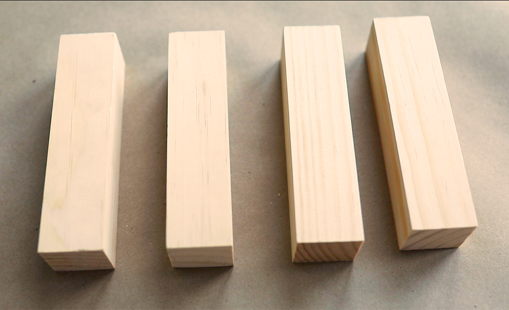Four wood pieces cut the same length.