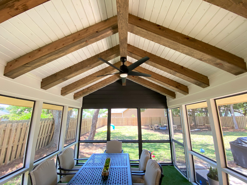A shot of a patio featuring recently renovated ceiling beams.