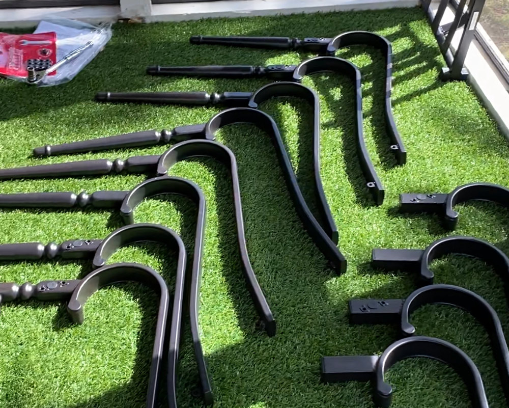 Chair parts and armrests lying on turf. Chair parts and armrests lying on turf.
