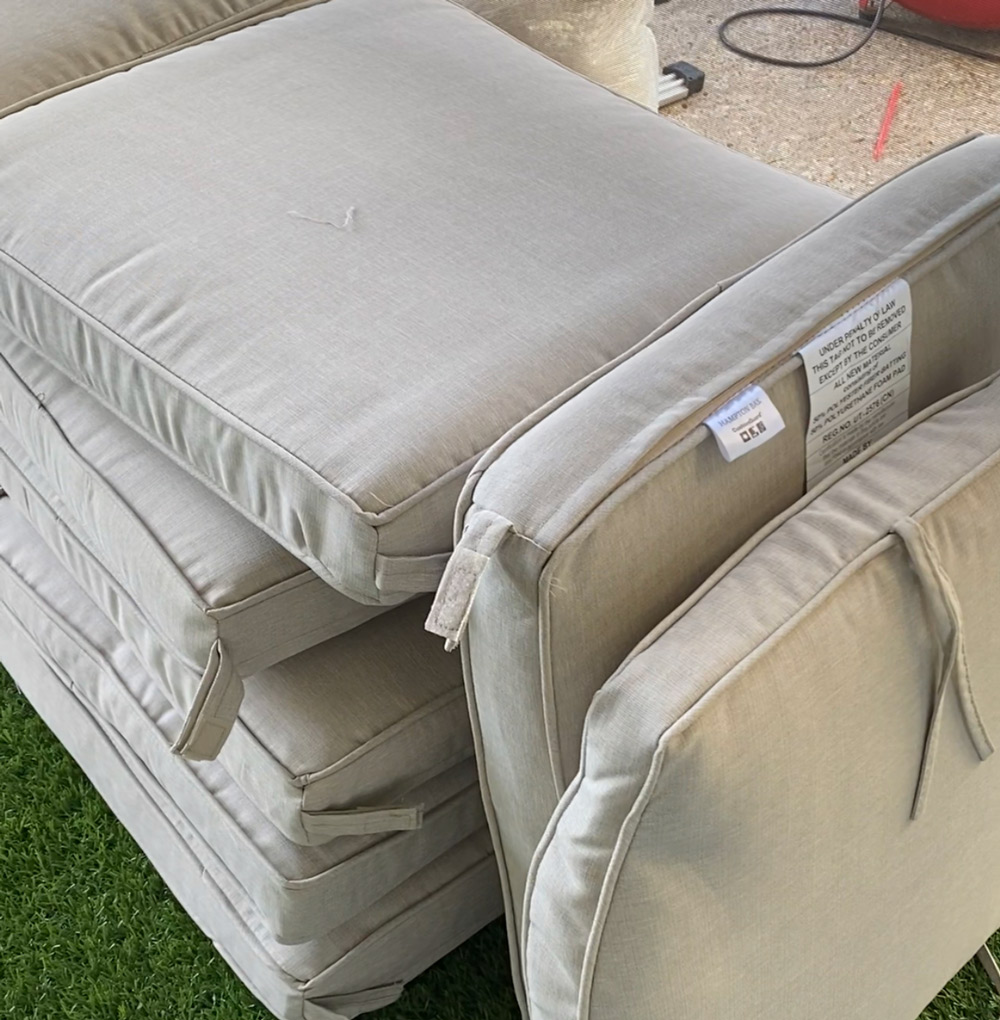 Patio cushions stacked and resting on each other. Patio cushions stacked and resting on each other.